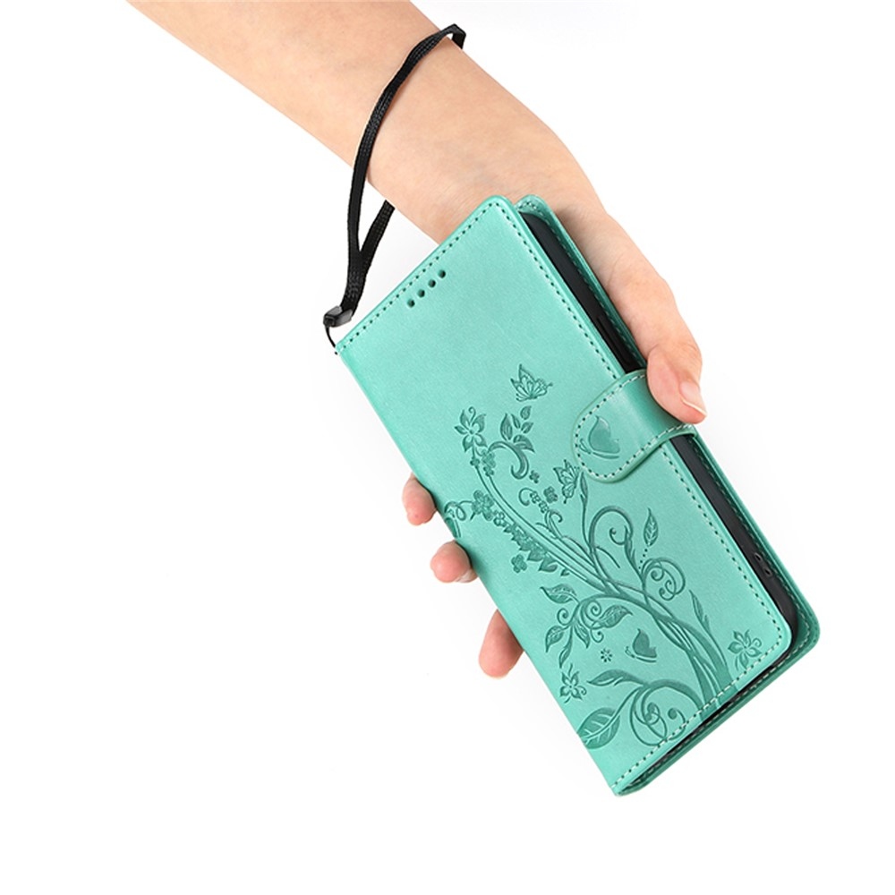 Flowery knížkové pouzdro na Xiaomi Redmi 15 5G (169mm) - modrozelené