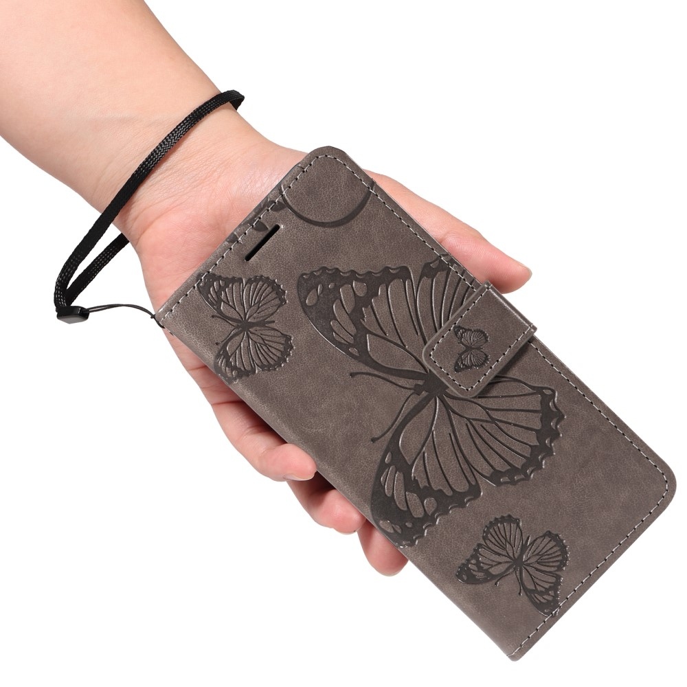 Big Butterfly knížkové pouzdro na Xiaomi Redmi Note 14 - šedé